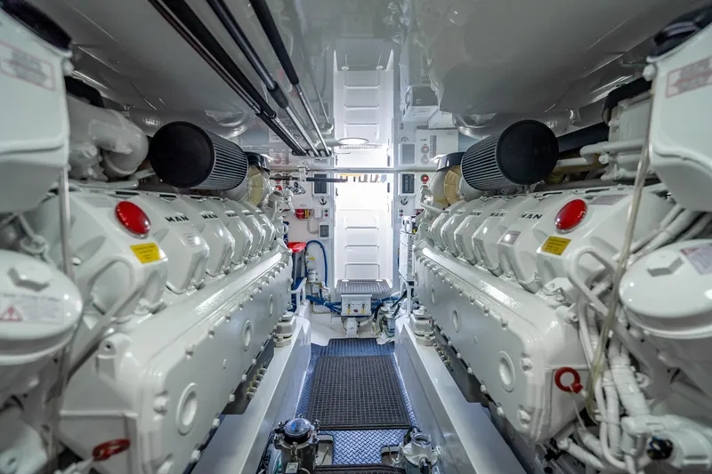 Slide: The Image of Engine room of 2026 Viking 54 Convertible yacht, featuring dual MAN engines. - 80