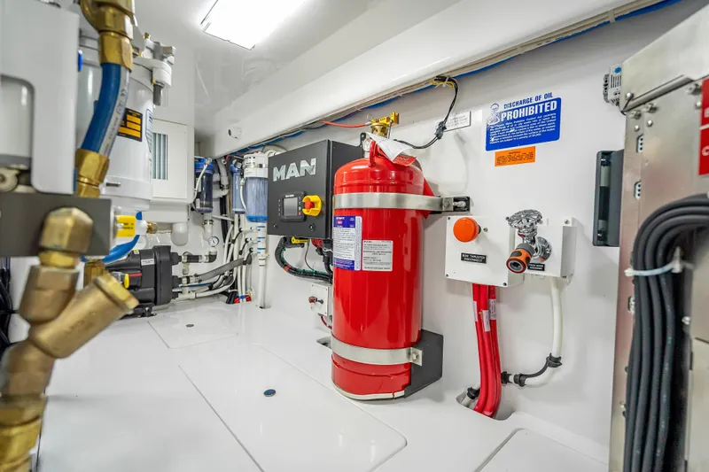 Slide: The Image of Engine room of 2026 Viking 54 Convertible yacht, featuring advanced equipment and safety systems. - 81