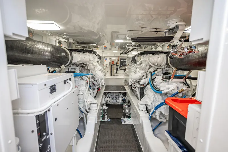 Slide: The Image of Engine room of 2026 Viking 54 Convertible yacht, showcasing advanced machinery and clean design. - 83