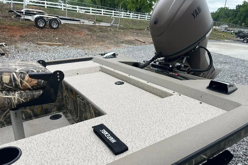 Slide: The Image of 2026 War Eagle 754VS Stick Steer boat with camo seat and Yamaha motor. - 6