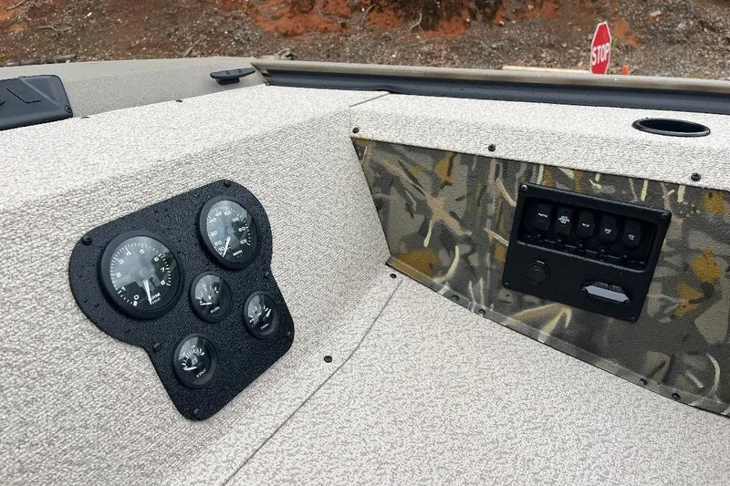 Slide: The Image of 2026 War Eagle 754VS Stick Steer boat dashboard with gauges and control panel. - 8