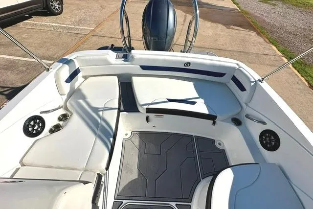 Slide: The Image of 2021 Hurricane SunDeck Sport 185 OB boat interior with seating and steering wheel. - 12