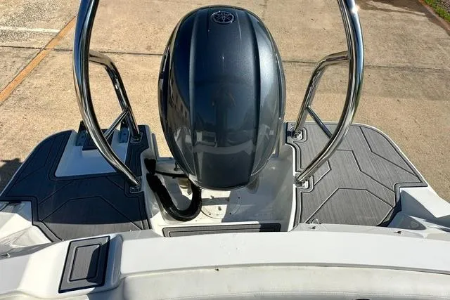 Slide: The Image of 2021 Hurricane SunDeck Sport 185 OB boat with sleek outboard motor and stylish deck design. - 18