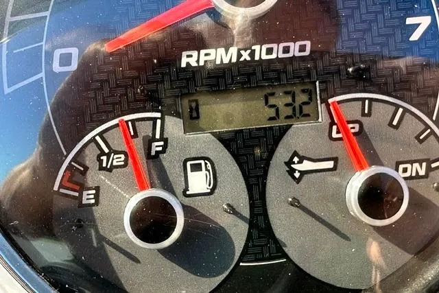 Slide: The Image of Close-up of 2021 Hurricane SunDeck Sport 185 OB dashboard gauges showing RPM and fuel levels. - 19