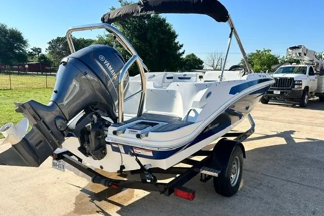 Slide: The Image of 2021 Hurricane SunDeck Sport 185 OB boat with Yamaha outboard engine on trailer. - 4