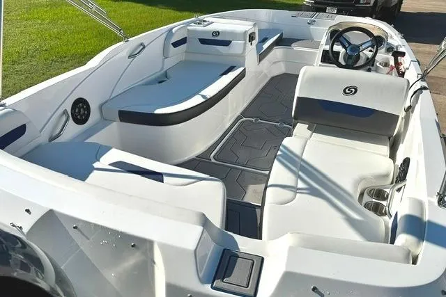 Slide: The Image of 2021 Hurricane SunDeck Sport 185 OB boat interior with seating and steering wheel. - 7