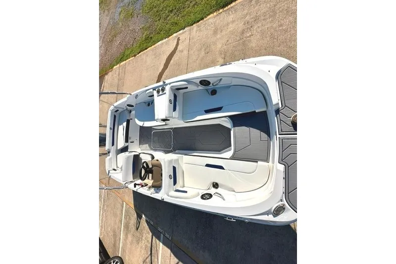 Slide: The Image of 2021 Hurricane SunDeck Sport 185 OB boat, aerial view, showcasing seating and deck layout. - 8