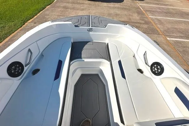 Slide: The Image of 2021 Hurricane SunDeck Sport 185 OB boat interior with seating and speakers. - 9