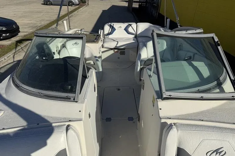 Slide: The Image of 2010 Monterey M5 Sport Boat interior with dual windshields and seating. - 21