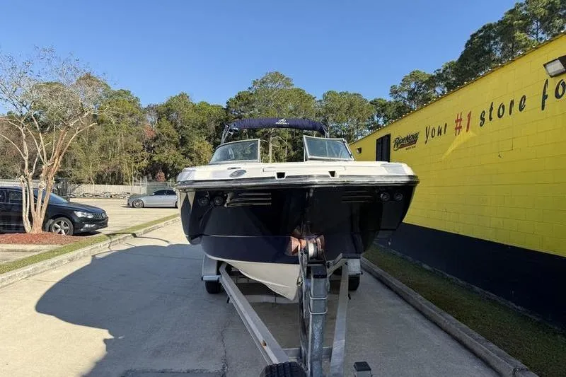 Slide: The Image of 2010 Monterey M5 Sport Boat on trailer in parking lot, sunny day. - 4
