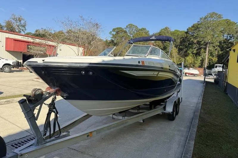 Slide: The Image of 2010 Monterey M5 Sport Boat on trailer in outdoor setting. - 5