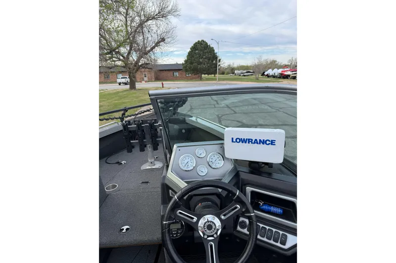 Slide: The Image of 2019 Lund 1950 Tyee Magnum ITS boat dashboard with Lowrance electronics and steering wheel. - 4