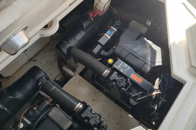 Slide: The Image of Engine compartment of a 1998 Cruisers Yachts 3870 Express, showcasing V8 engine components. - 16