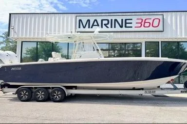 The Image of 2012 Jupiter 34 FS boat on trailer outside Marine 360 dealership. - 1