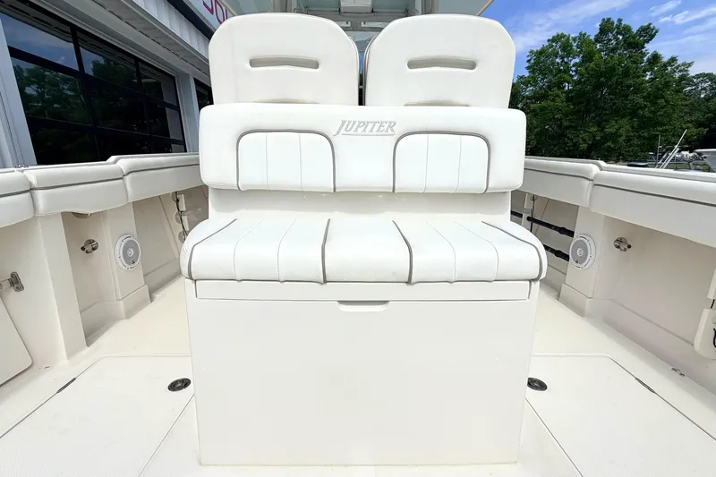Slide: The Image of 2012 Jupiter 34 FS boat with white seating and spacious deck area. - 12