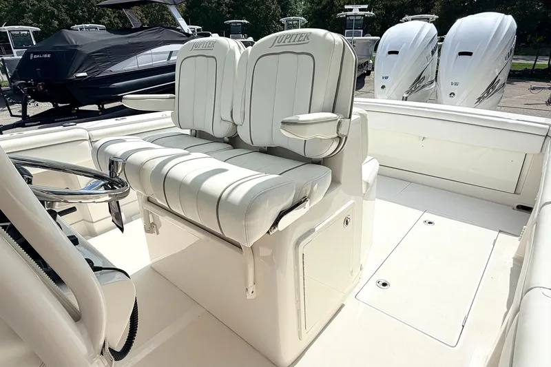 Slide: The Image of 2012 Jupiter 34 FS boat interior with dual seats and steering wheel. - 15