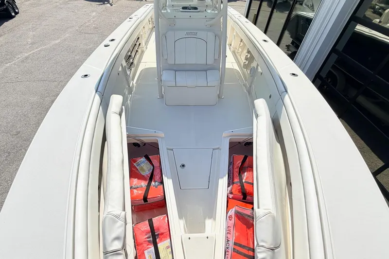 Slide: The Image of 2012 Jupiter 34 FS boat interior with seating and life jackets. - 23