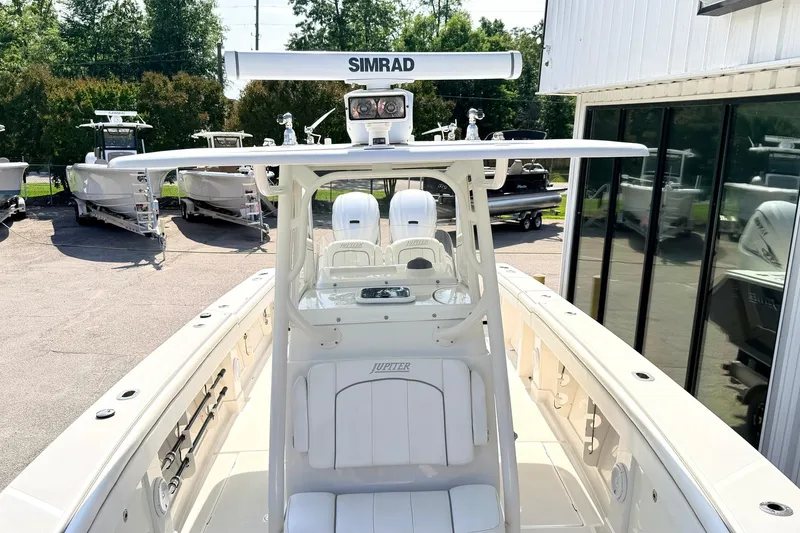 Slide: The Image of 2012 Jupiter 34 FS boat with Simrad radar, docked near other boats. - 24