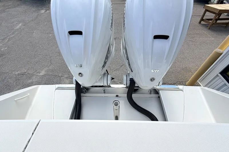 Slide: The Image of Twin V8 outboard engines on a 2012 Jupiter 34 FS boat, viewed from above. - 6