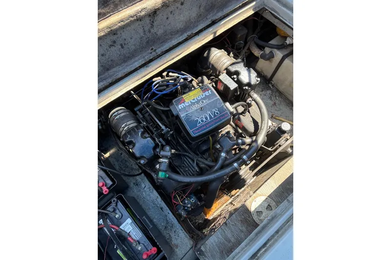 Slide: The Image of Engine compartment of 1987 Four Winns 245 Vista boat, featuring MerCruiser Alpha One 260 V8. - 11