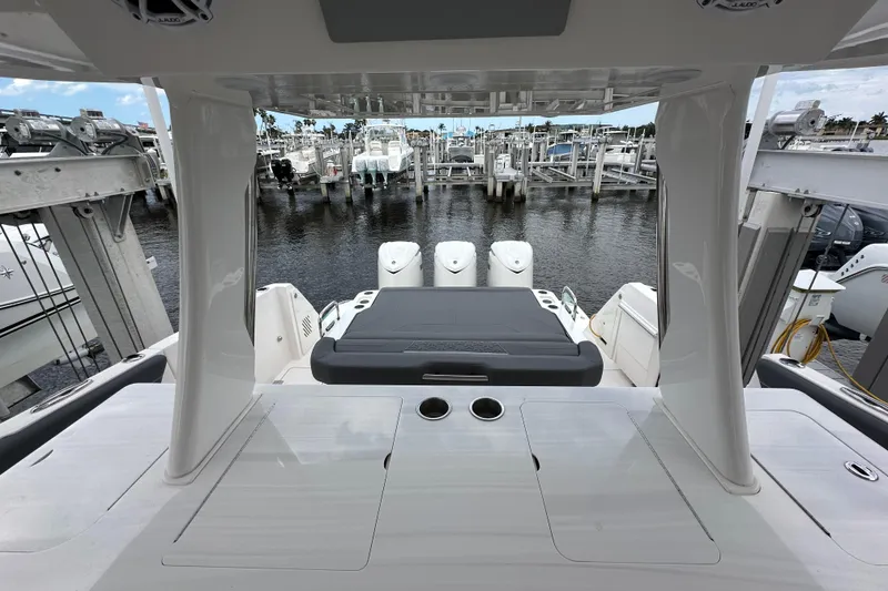 Slide: The Image of 2025 Regal 38 SAV boat interior with sleek design, docked at marina. - 7