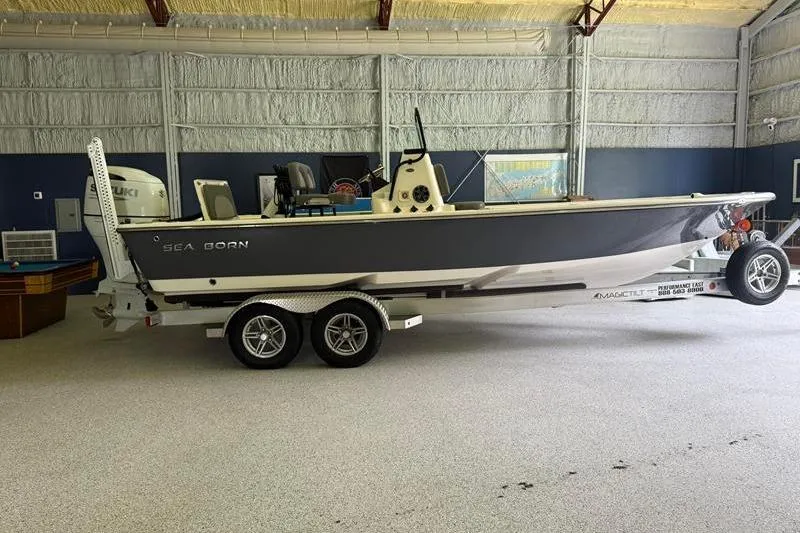 The Image of 2023 Sea Born FX22 Bay boat on trailer in indoor storage facility. - 0