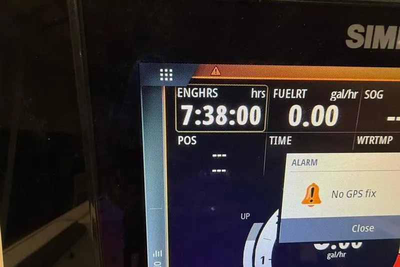 Slide: The Image of Simrad marine display showing engine hours and GPS alert on Sea Born FX22 Bay. - 14