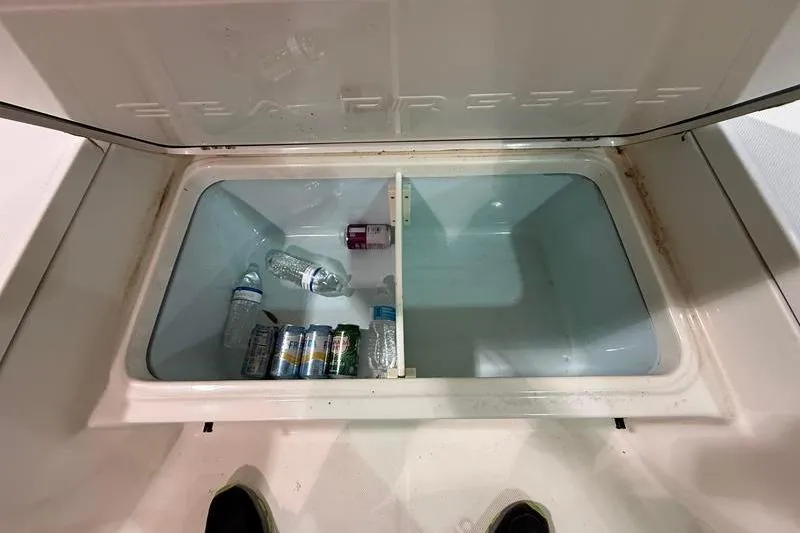 Slide: The Image of 2023 Sea Born FX22 Bay boat cooler with drinks and water bottles inside. - 20