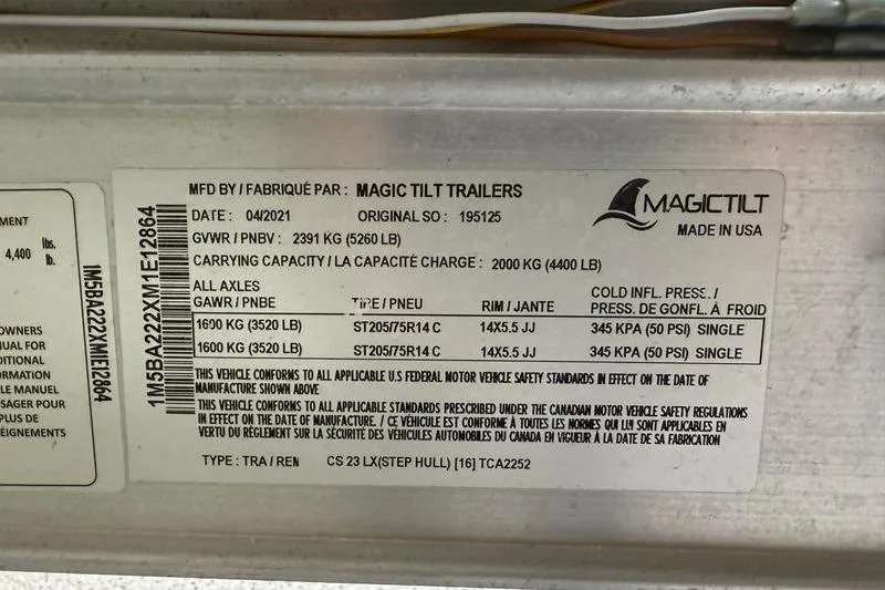 Slide: The Image of Magic Tilt Trailers label with specifications for Sea Born FX22 Bay, 2023 model. - 25