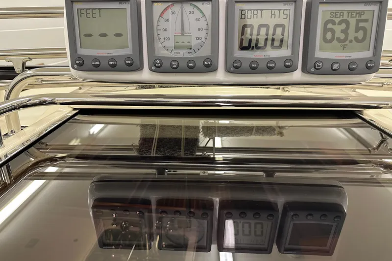 Slide: The Image of Control panel of a 2007 Sabre 386 yacht displaying depth, speed, and sea temperature. - 100