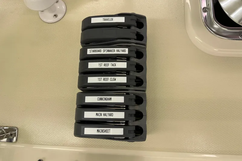 Slide: The Image of Sailing rope clutches labeled for various functions on a Sabre 386 yacht, 2007 model. - 107