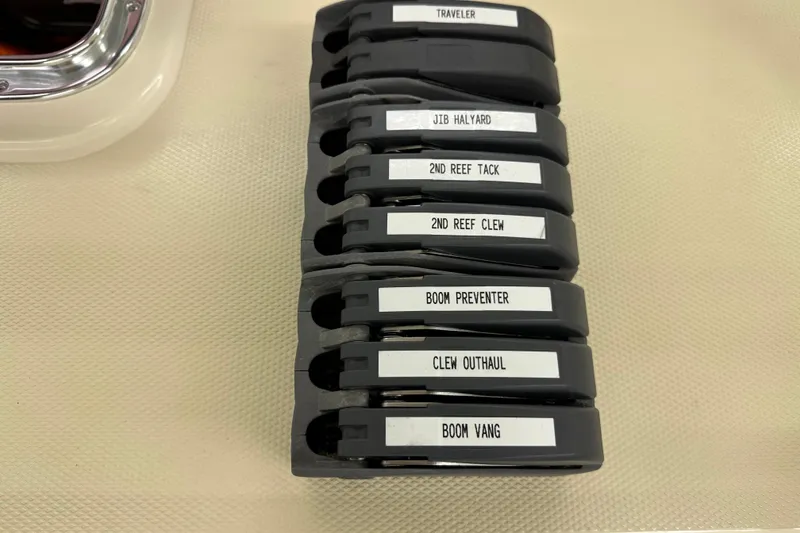 Slide: The Image of Sailing rope clutches labeled for various functions on a 2007 Sabre 386 yacht. - 108