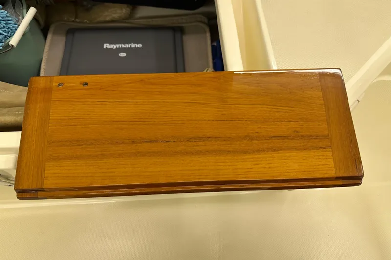 Slide: The Image of Wooden panel on a Sabre 386 yacht, 2007 model, with Raymarine equipment visible. - 113