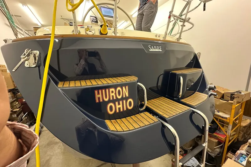 Slide: The Image of 2007 Sabre 386 yacht in a garage, featuring "Huron Ohio" on the stern. - 122