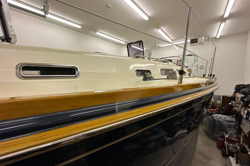 Slide: The Image of 2007 Sabre 386 yacht in a well-lit indoor storage space. - 128