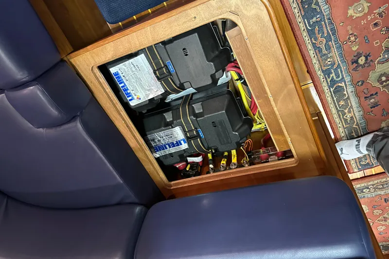 Slide: The Image of Battery compartment in a 2007 Sabre 386 yacht, featuring Lifeline batteries and wiring. - 129