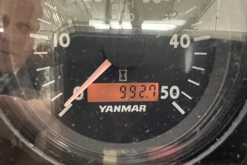 Slide: The Image of Close-up of a Yanmar engine hour meter displaying 392.7 hours on a Sabre 386, 2007 model. - 130