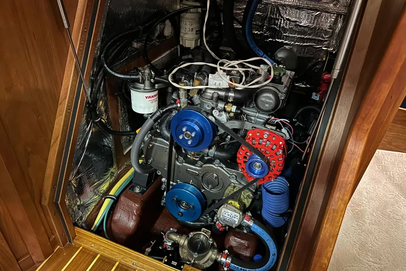 Slide: The Image of Engine compartment of a 2007 Sabre 386 sailboat with visible Yanmar components. - 131