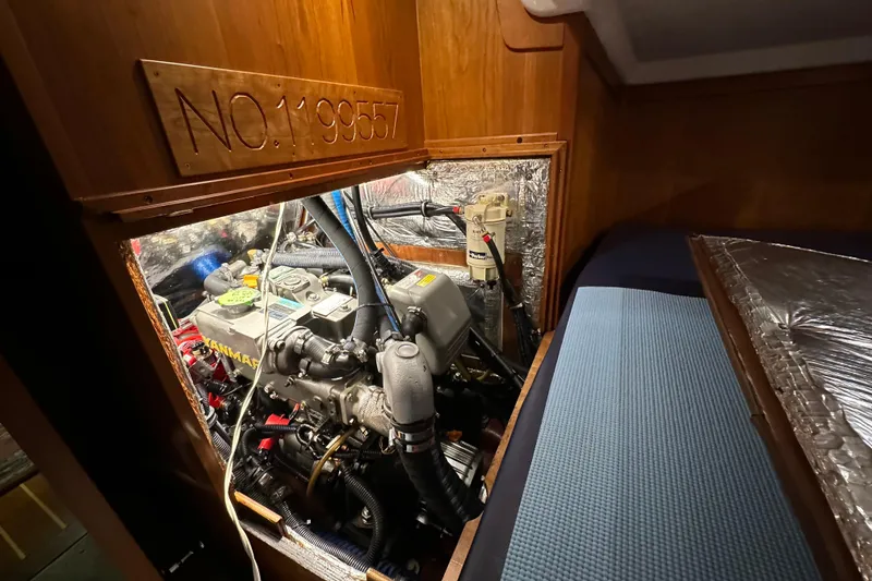 Slide: The Image of Engine compartment of a 2007 Sabre 386 sailboat, featuring a Yanmar engine. - 133