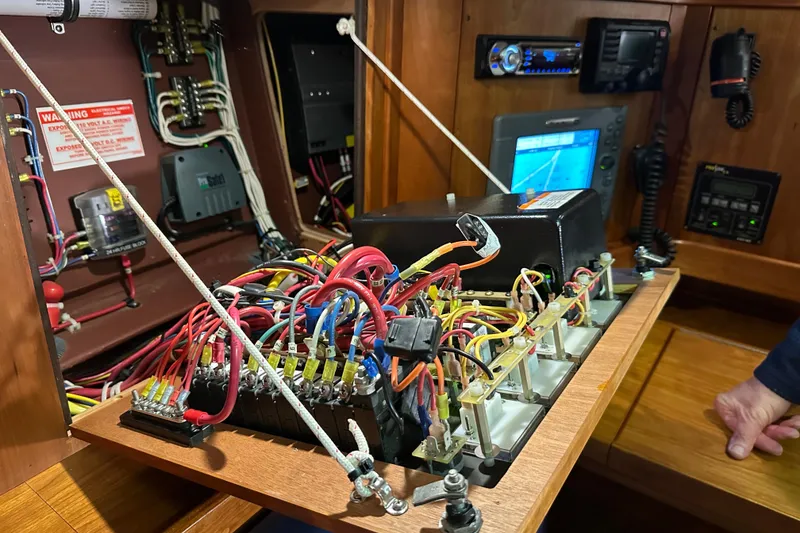 Slide: The Image of Electrical panel with wiring in a 2007 Sabre 386 boat, showcasing navigation equipment. - 135