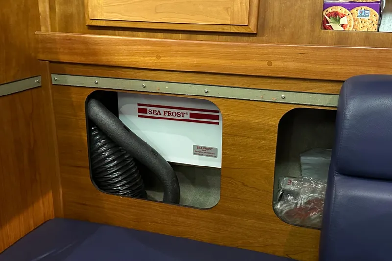 Slide: The Image of Wooden interior of a 2007 Sabre 386 yacht featuring a Sea Frost refrigeration unit. - 137
