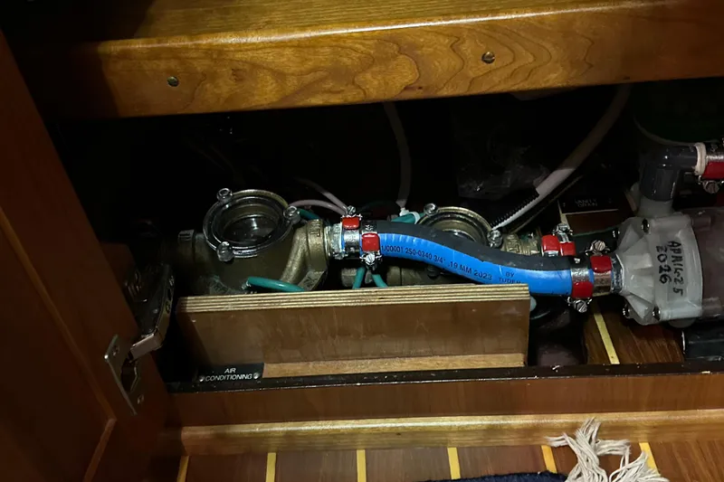 Slide: The Image of Air conditioning system components in a 2007 Sabre 386 yacht, featuring pipes and valves. - 138