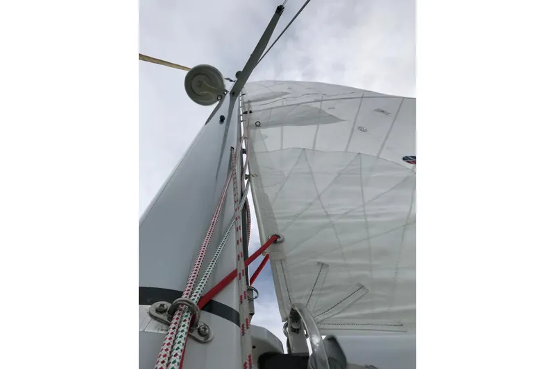Slide: The Image of Close-up of Sabre 386 sailboat mast and sails, 2007 model, against cloudy sky. - 141