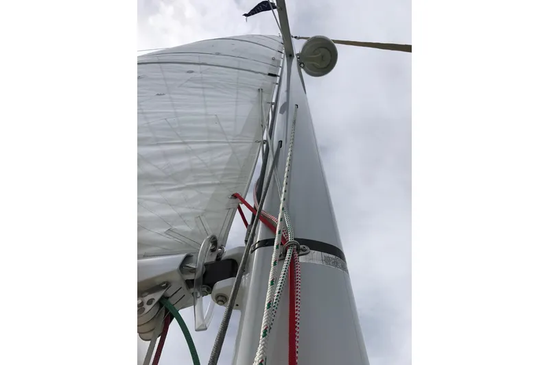 Slide: The Image of Close-up of a 2007 Sabre 386 sailboat mast and rigging against a cloudy sky. - 142