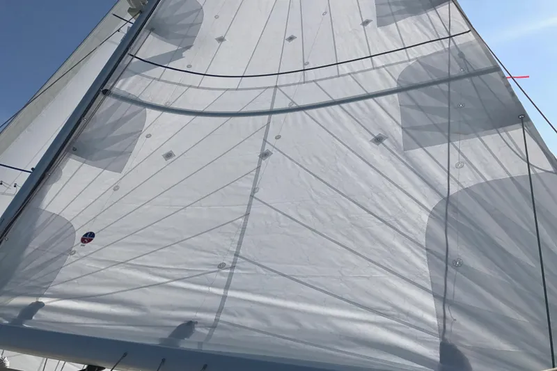 Slide: The Image of Sail of a 2007 Sabre 386 yacht against a clear blue sky. - 146