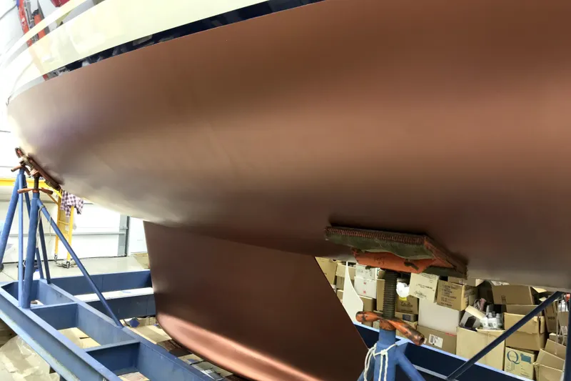 Slide: The Image of 2007 Sabre 386 sailboat hull in dry dock, showcasing smooth, polished finish. - 154