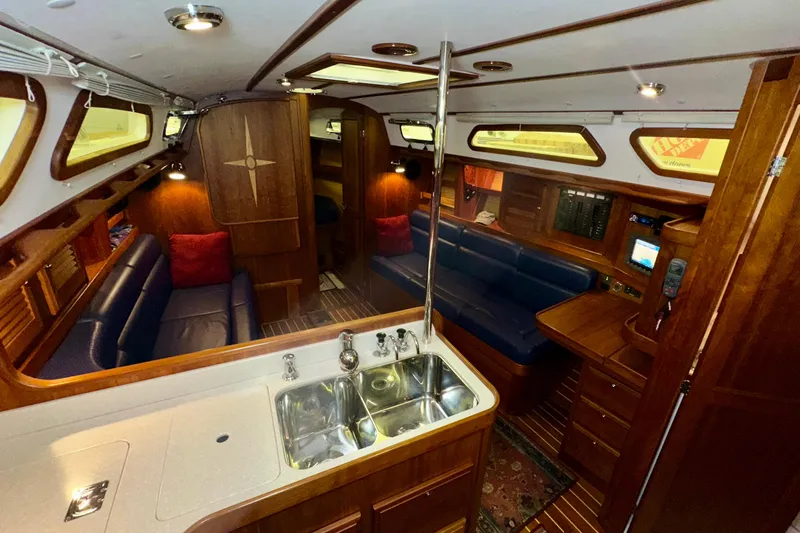 Slide: The Image of Luxurious interior of a 2007 Sabre 386 yacht with elegant wood finishes and cozy seating. - 19