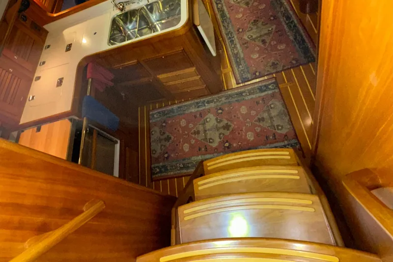 Slide: The Image of Interior of 2007 Sabre 386 yacht with wooden stairs and kitchen area. - 20