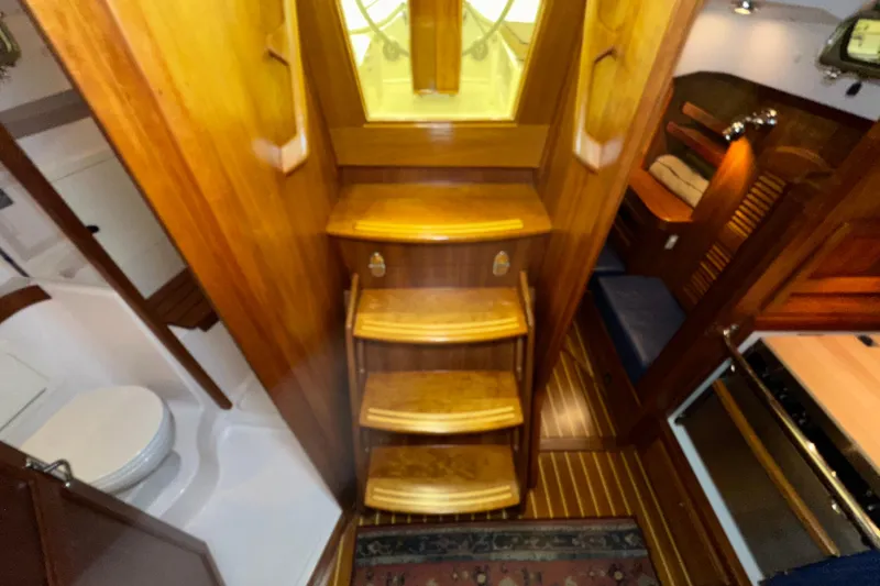 Slide: The Image of Interior of 2007 Sabre 386 yacht with wooden stairs and cozy cabin layout. - 27