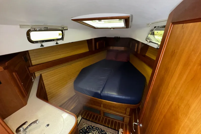 Slide: The Image of Cozy cabin interior of 2007 Sabre 386 yacht with wooden finish and comfortable bedding. - 35